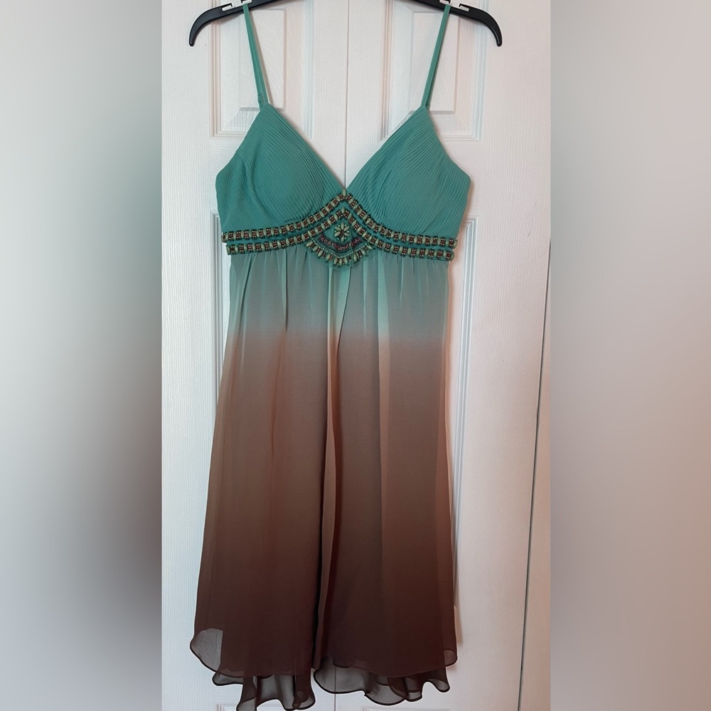 Beautiful beaded cocktail dress with chiffon layers.  Like new, only worn twice.